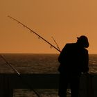 pêcheur sur la jetée