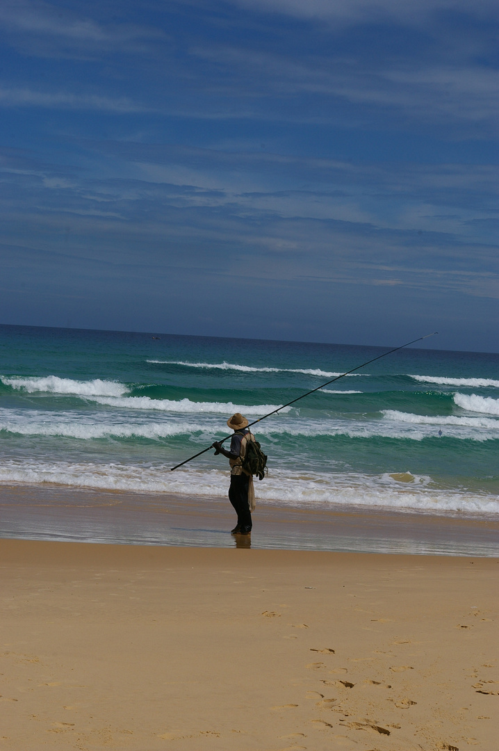 pêcheur sur la plage