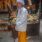 Pemangku priest at the offering altar
