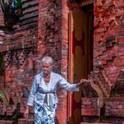 Pemangku woman enters the temple