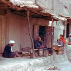 People have meals in front of their houses in Herat