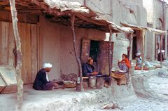 People have meals in front of their houses in Herat