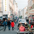 People, lady in red and the street.