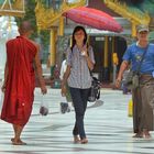 People walk around the Shwedagon pagoda
