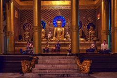 Pilgrims meditation in Shwedagon complex