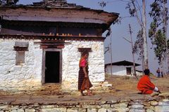 Pilgrims pass the chorten top the Wangdue Phodrang dzong