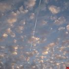 Plane behind the clouds