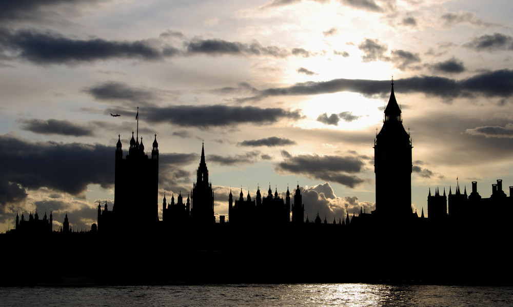 Plane flying over Big Ben