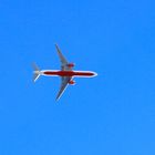 plane in a blue sky