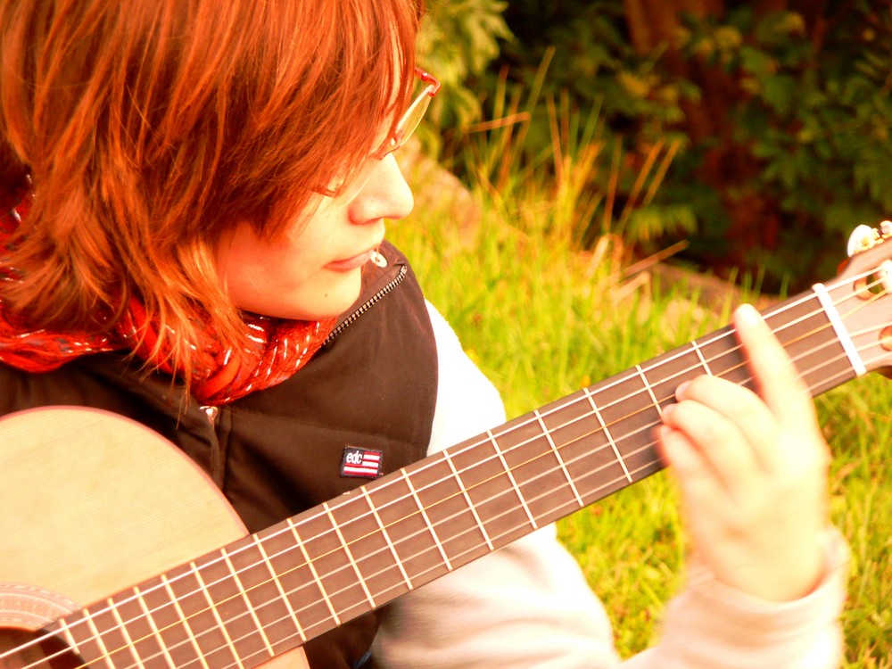 playing the guitar in the sun