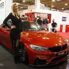 Playmate Tanja Brockmann an einem BMW auf der Essen Motor Show 2016