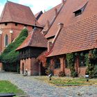 Polen: Ordensburg Marienburg  Fachwerk mit Turmspitze und Dachlandschaften