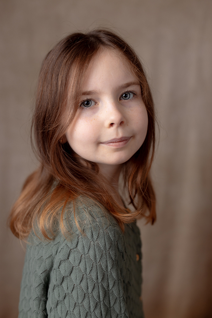 Portrait of a girl with grey-green cardigan