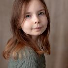 Portrait of a girl with grey-green cardigan