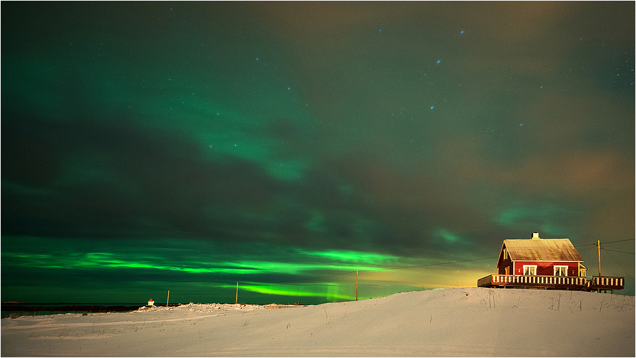 Powerful Aurora behind the clouds