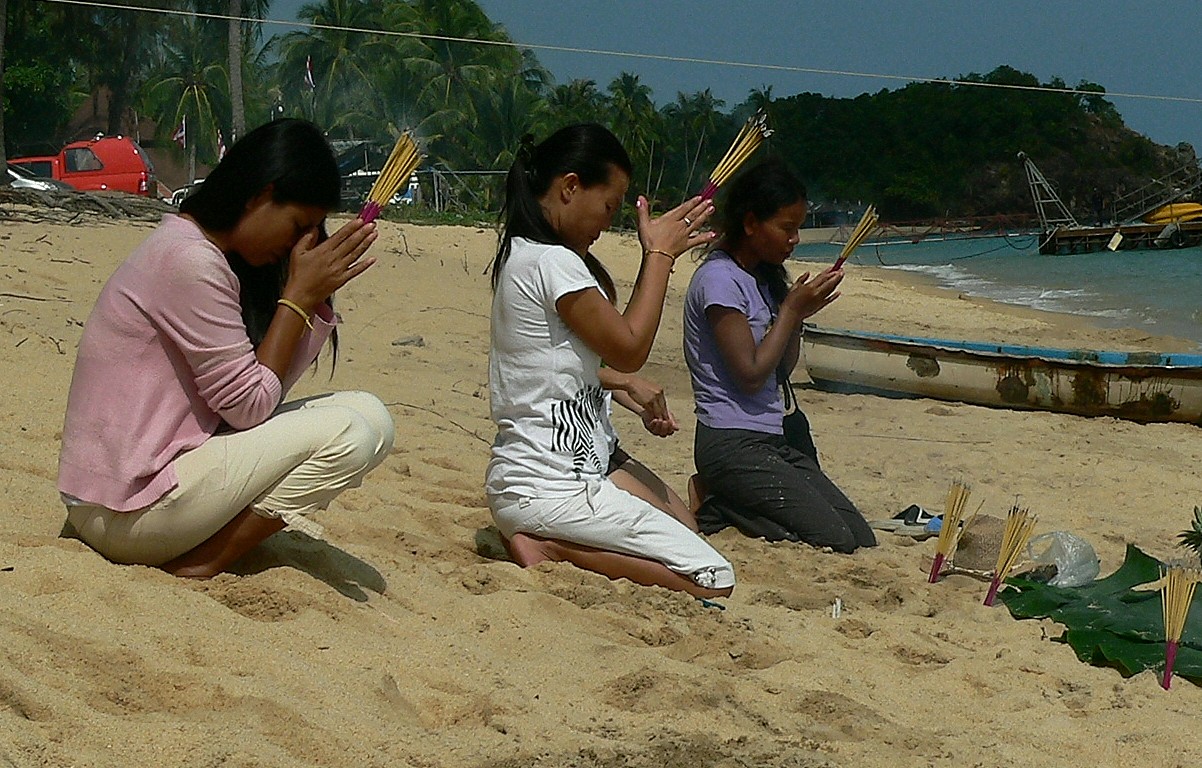 Prayer and offering on the beach Mae Nam