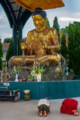 Praying in front of Buddha beside Botataung Pagoda