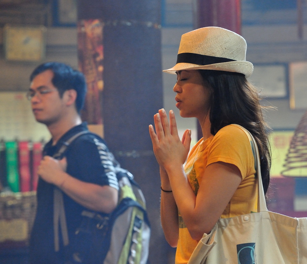 Praying in Man Mo Temple