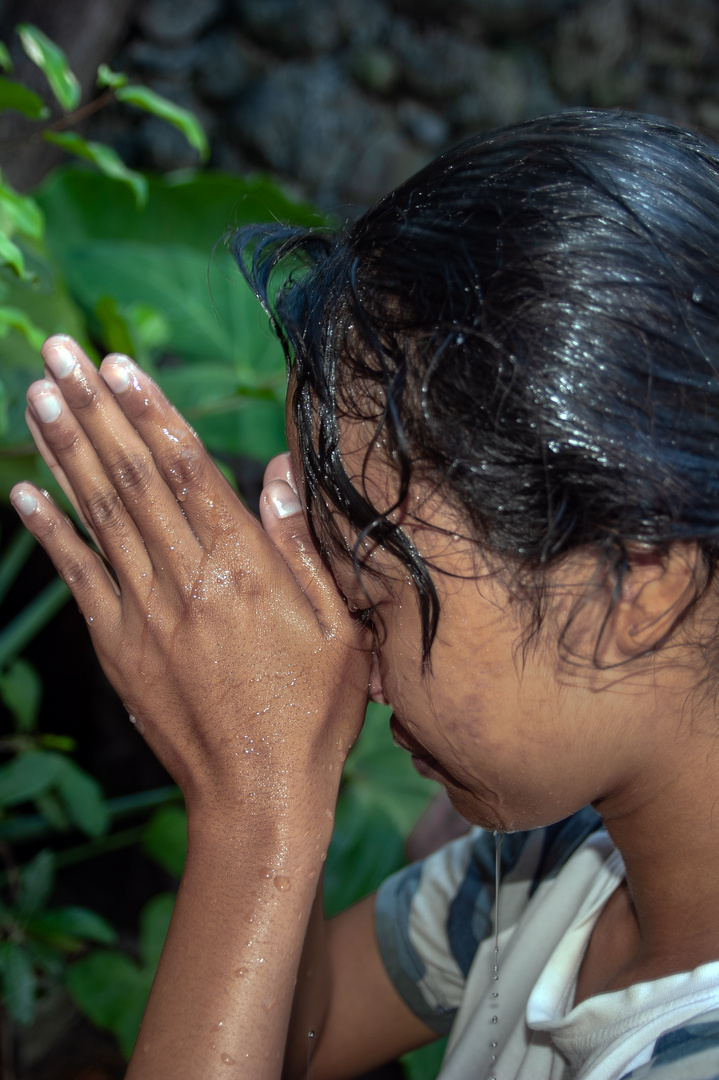 Praying young Hindu woman