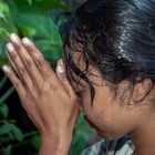 Praying young Hindu woman