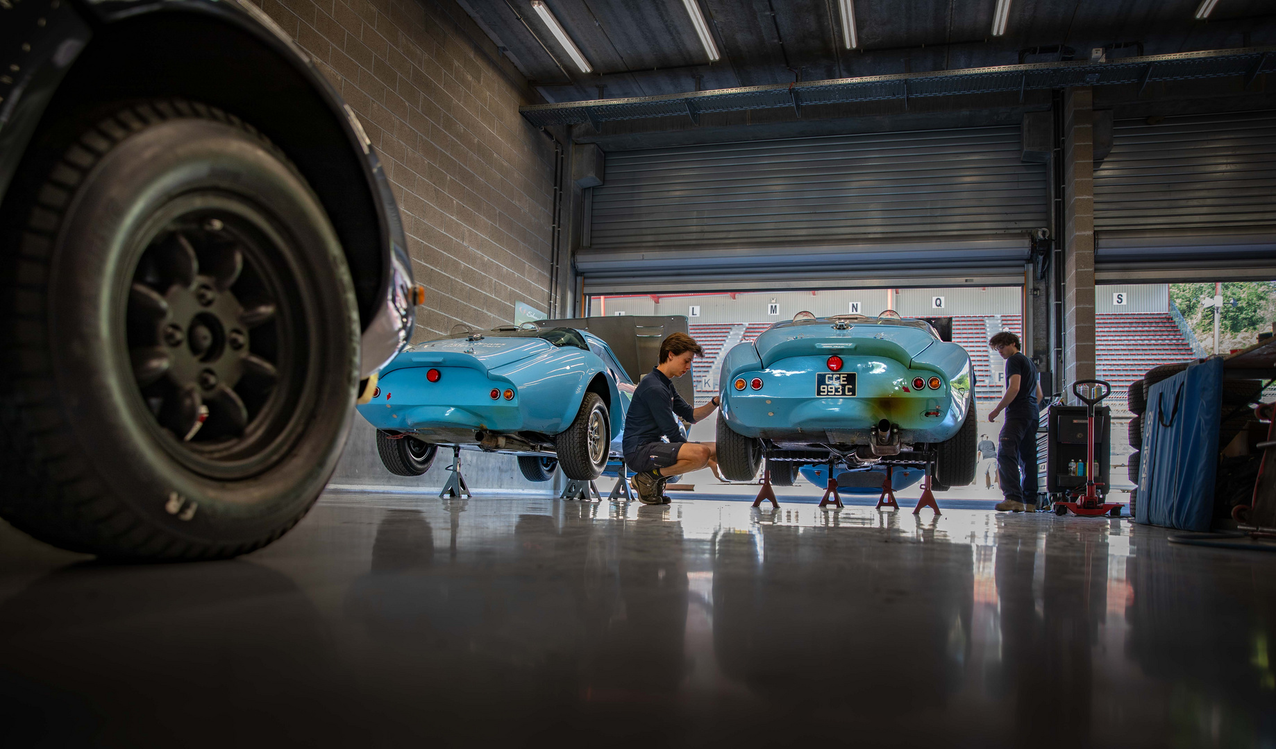 Preparing Marcos racecars in the pits.