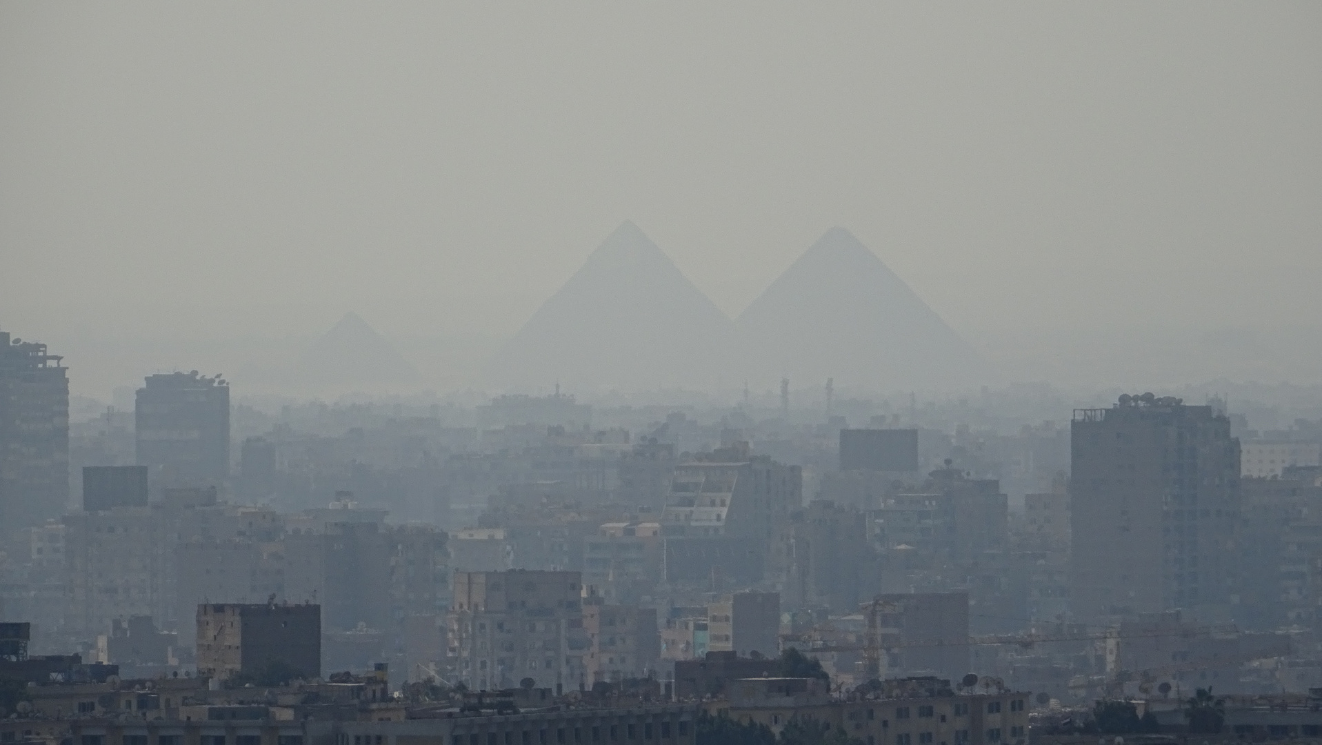 Pyramids behind the city