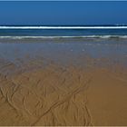 Quand la mer dessine sur le sable