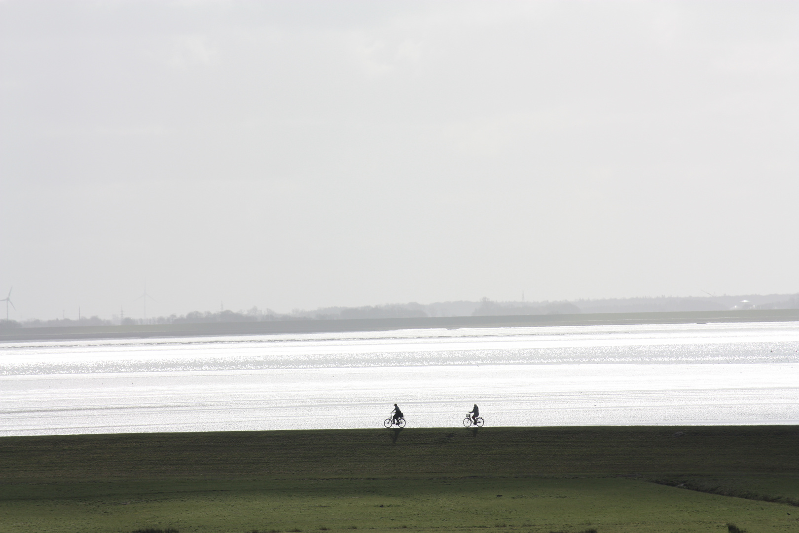 Radfahrer am Strand