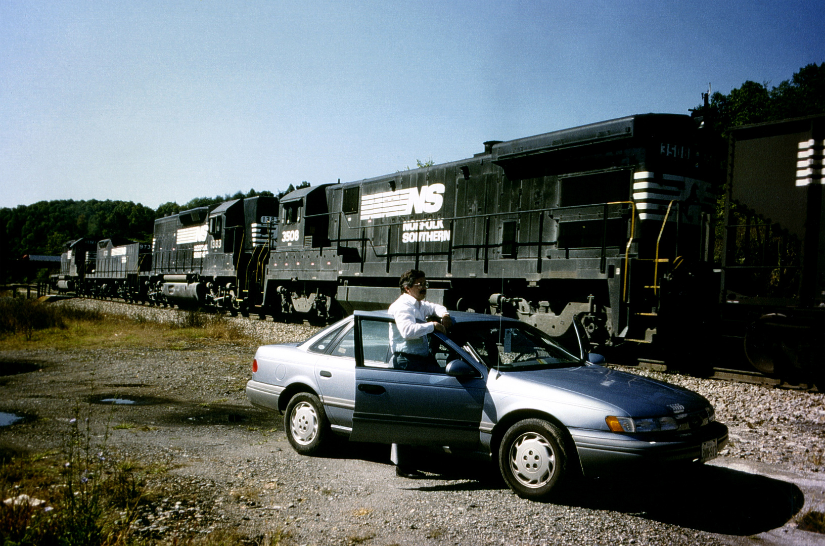 Railfan watching a Norfolk & Southern Coal Train at Montgomery Tunnel, VA