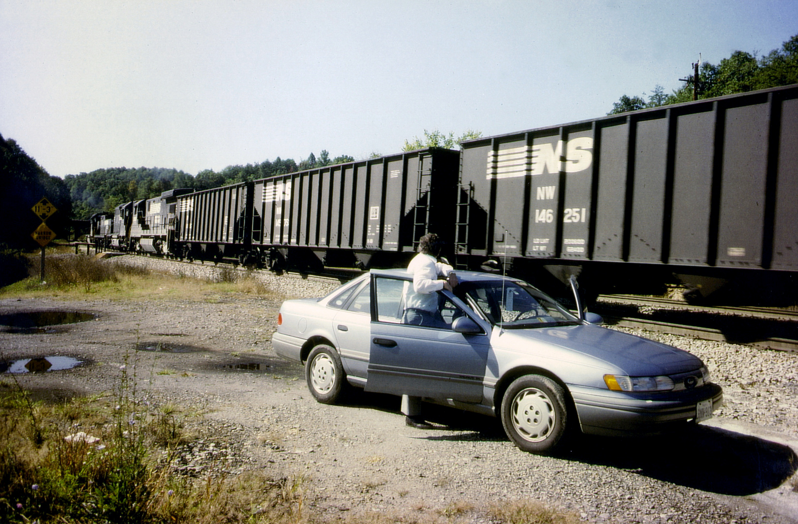 Railfan watching a Norfolk & Southern Coal Train at Montgomery Tunnel, VA