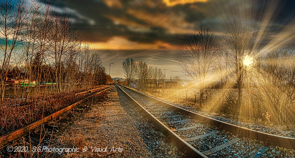 Railways crossing in the colorful lighting sunrise 