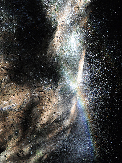 rainbow in the depth of a waterfall