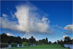 rainbow over cemetery