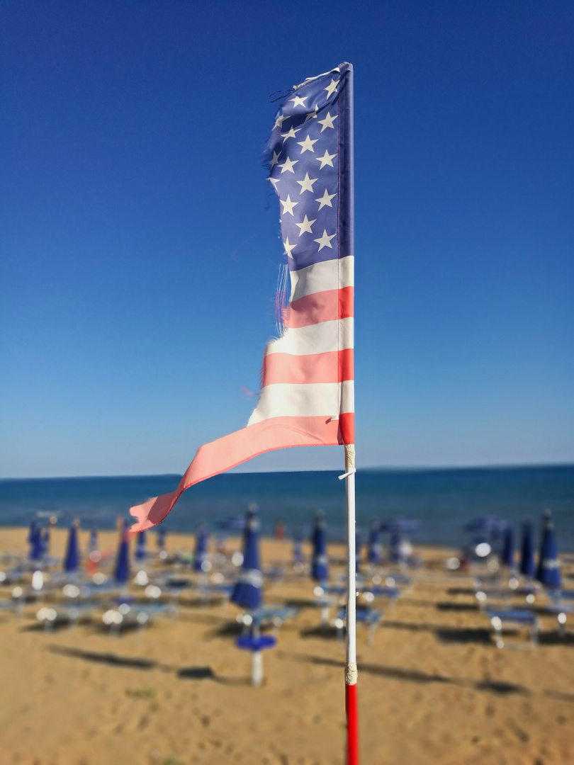 Raising the Flag on the beach  