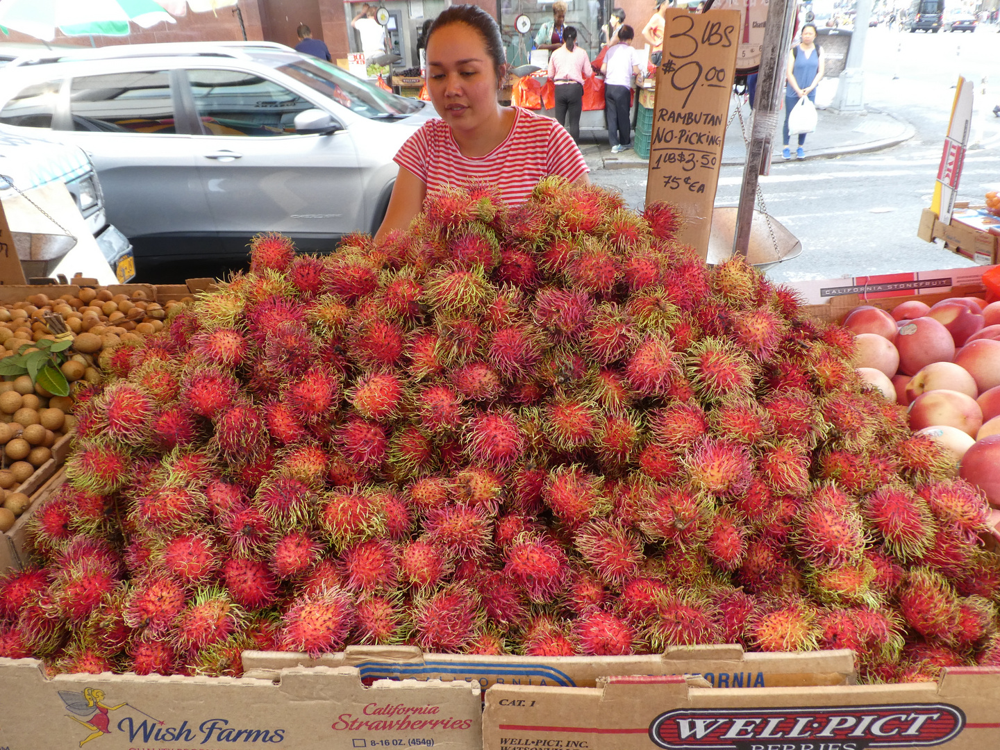 Rambutanverkäuferin in Chinatown - New York