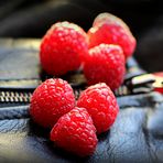 Raspberries on leather jacket