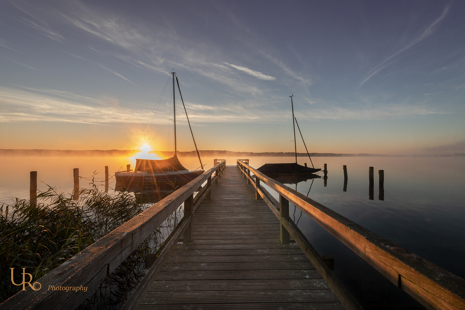 Ratzeburger See mit aufsteigender Sonne und aufsteigendem Nebel