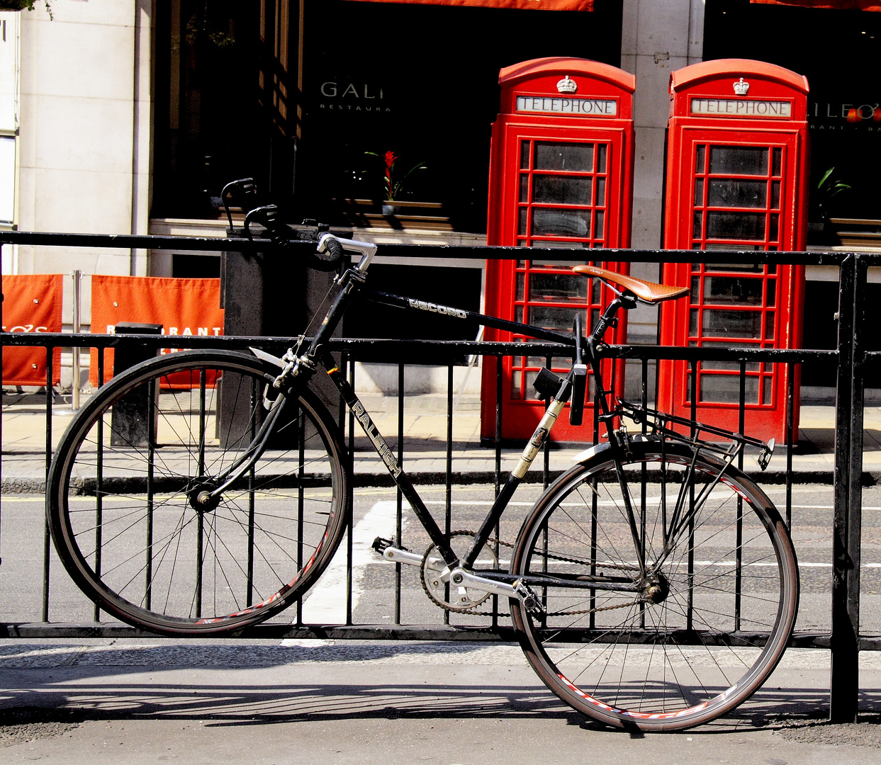 red cabs and bicycle