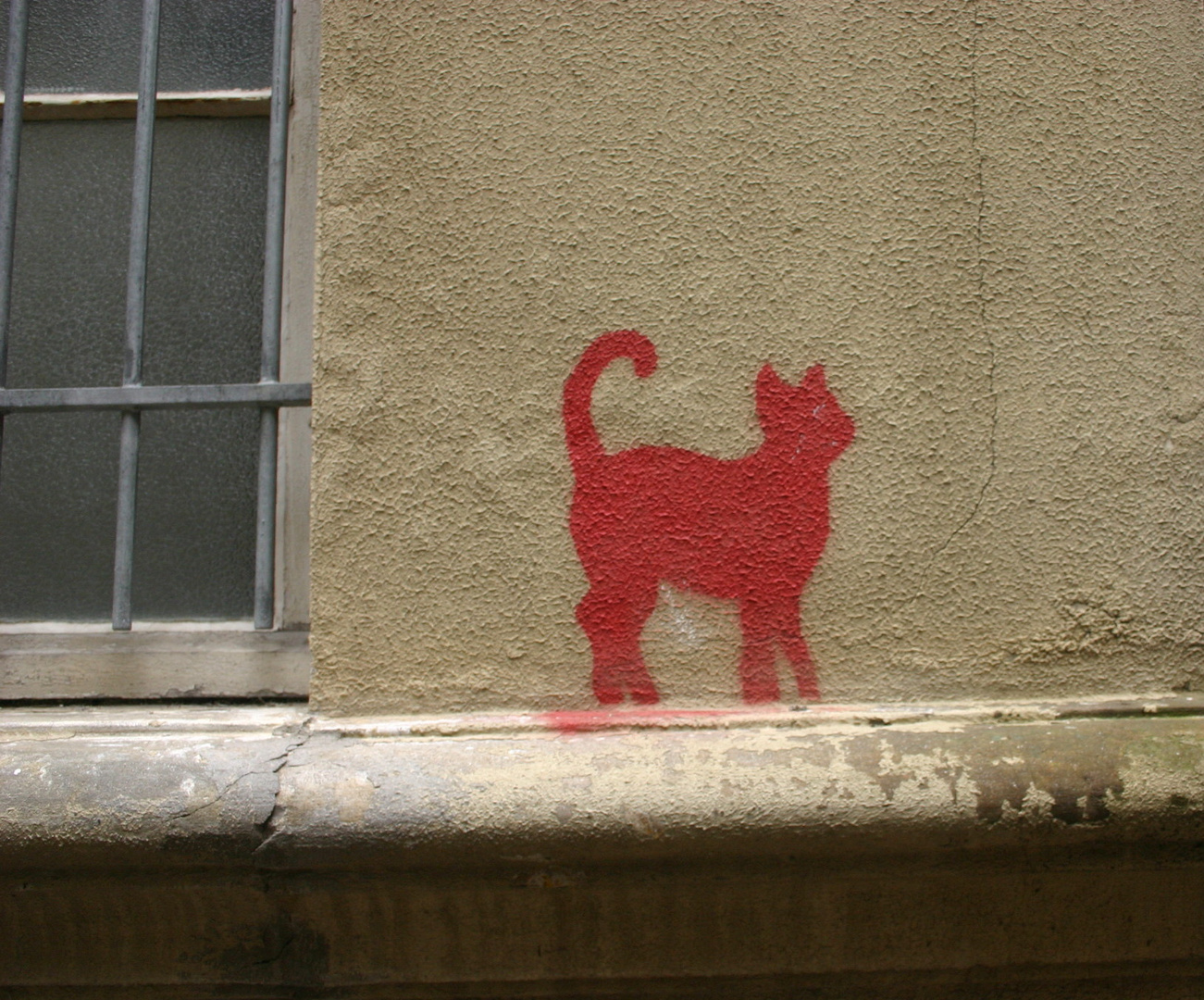 Red Cat on the Wall