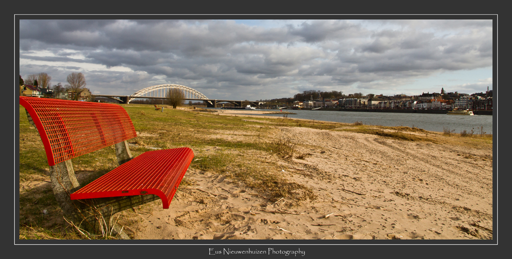 Red Couch on riverbeach