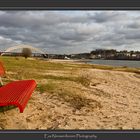 Red Couch on riverbeach