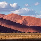 Red Dunes of the Namib with clouds.