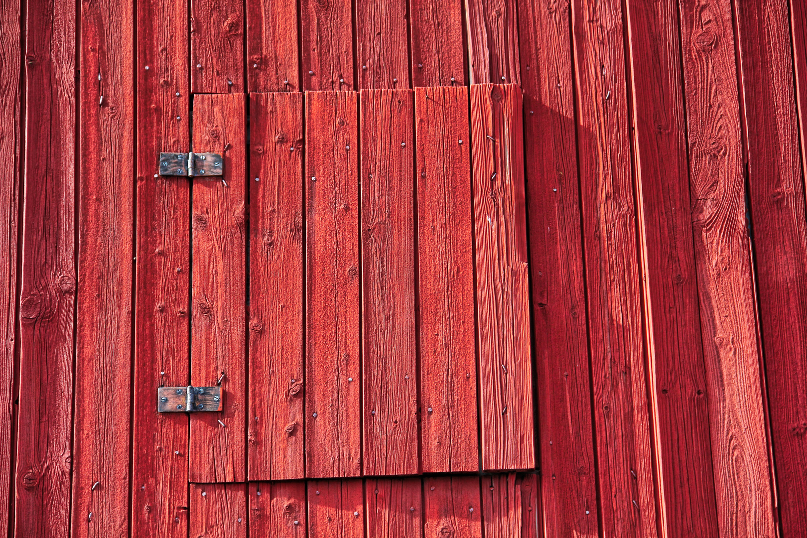 red hatch in red wall