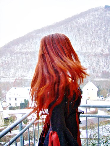 red headed medieval girl in the snow