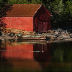 red house with boat