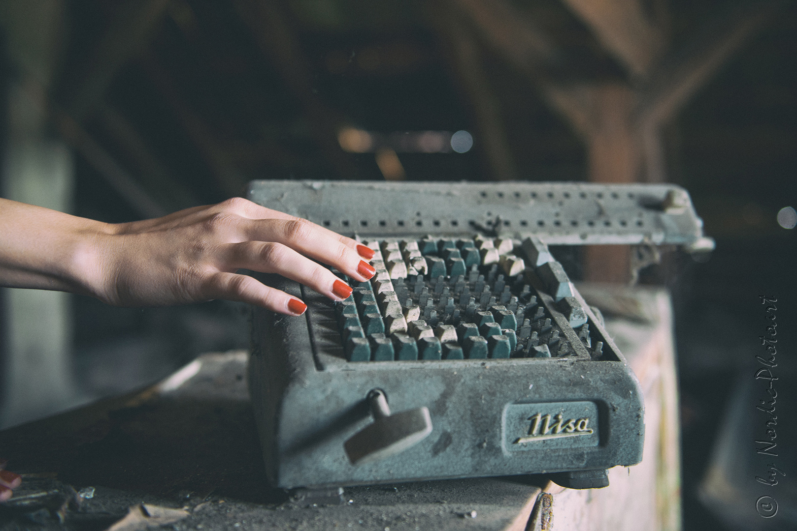 red nails on typewriter