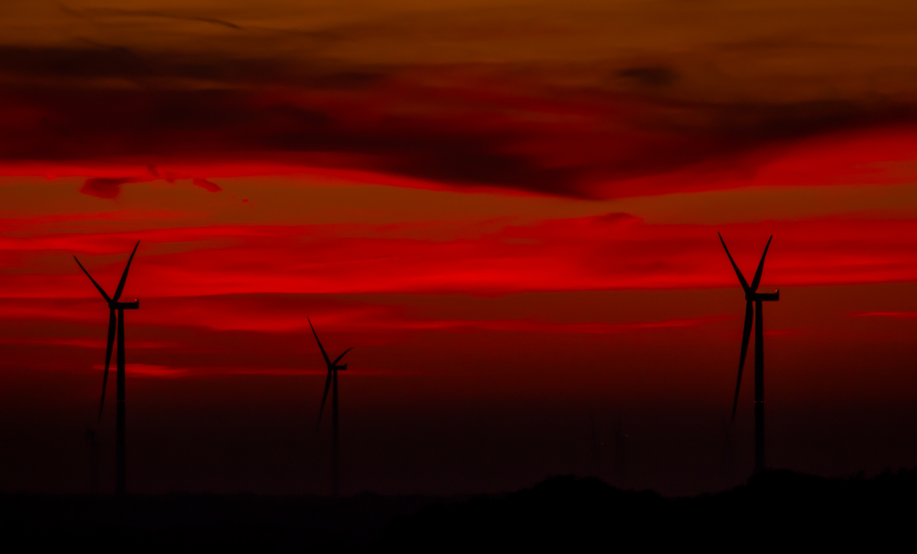 Red Sky And Wind Turbines