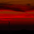 Red Sky And Wind Turbines
