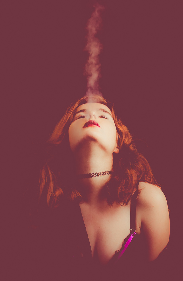 Redhaired girl smoking