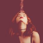 Redhaired girl smoking